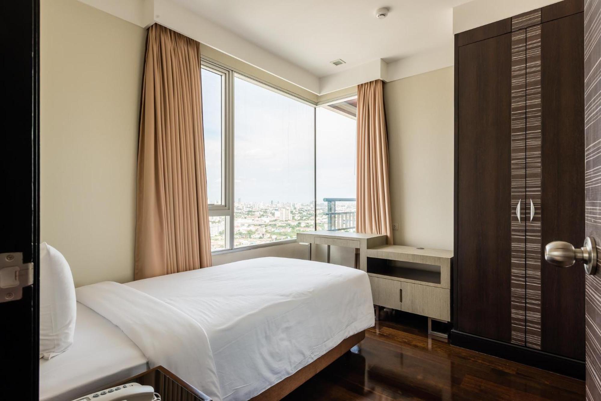 Jasmine Grande Residence Bangkok Ngoại thất bức ảnh A bedroom in a serviced apartment in Cairo, Egypt